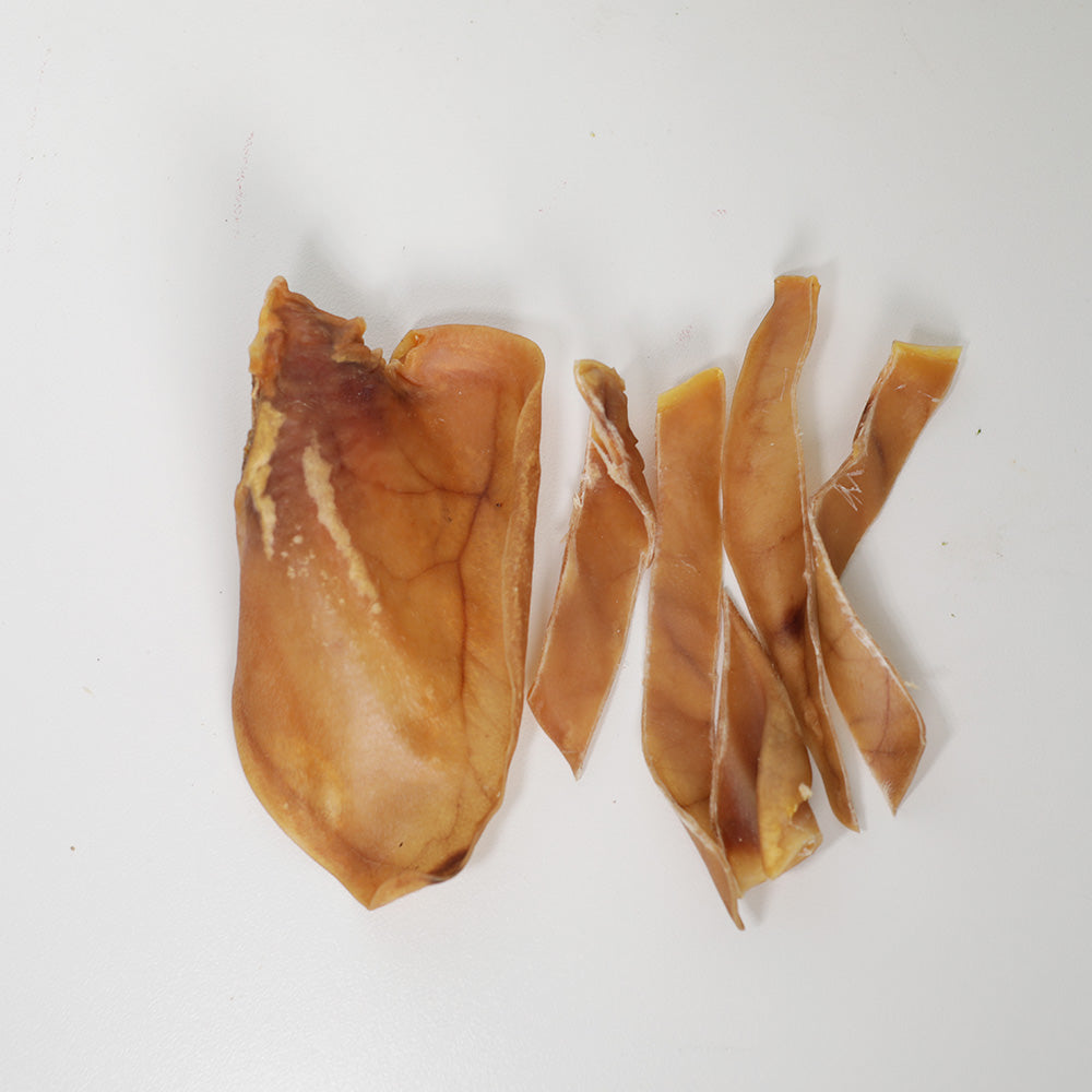 Top view of Pig Ear Dog Treats Whole and Sliced Pig Ears for Dogs