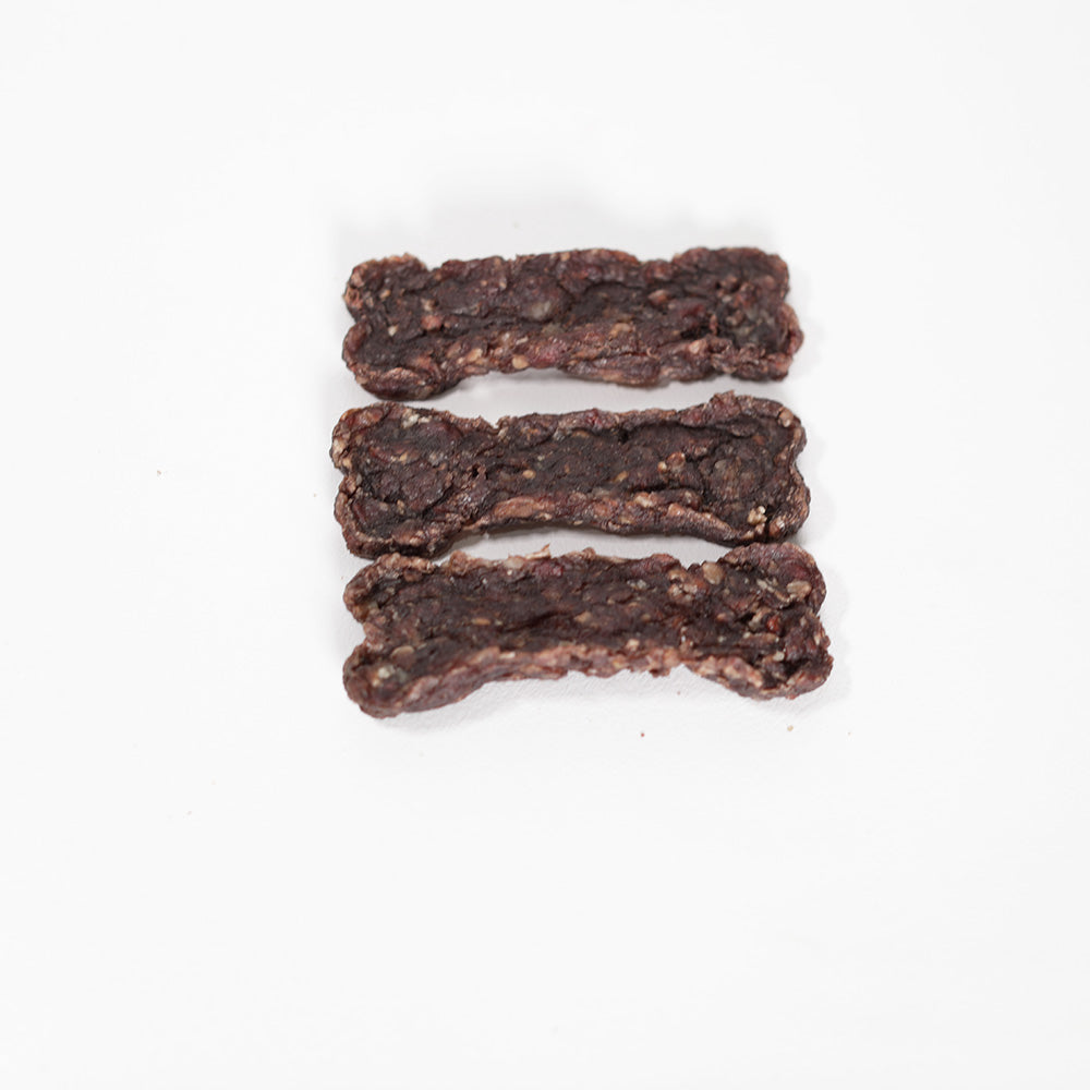 Top view of Beef Jerky shaped in bone biscuits for dog treats