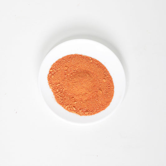 Top view of Carrot Sprinkles made of dehydrated carrot powder and meal toppers for dogs and dog treat ideas