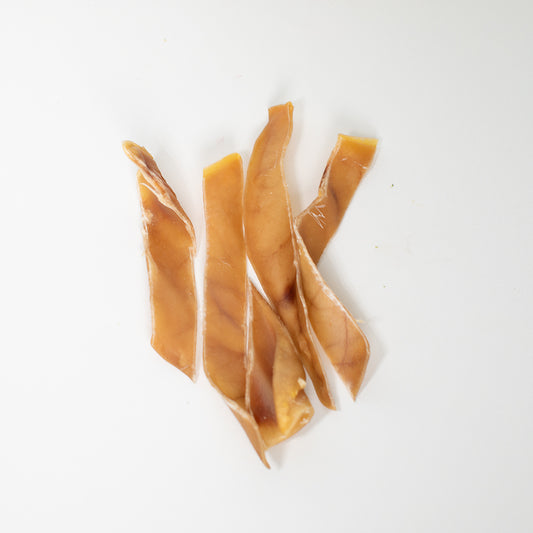 Top view pig ears strips dog treats