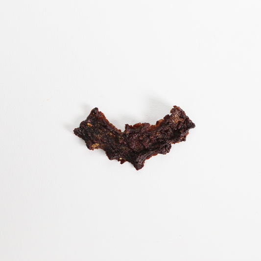 Top view of kangaroo jerky dog treats shaped in a bat shape dog biscuit